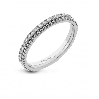 A line of .33 ctw of white diamonds sits alongside a row of granulation in this band that adds the ideal touch of shine. perfect for stacking with other rings.